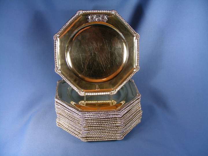 18 George II silver gilt octagonal plates